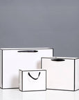White with Black Border Paper Gift Bag w/ free tissue