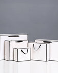White with Black Border Paper Gift Bag w/ free tissue