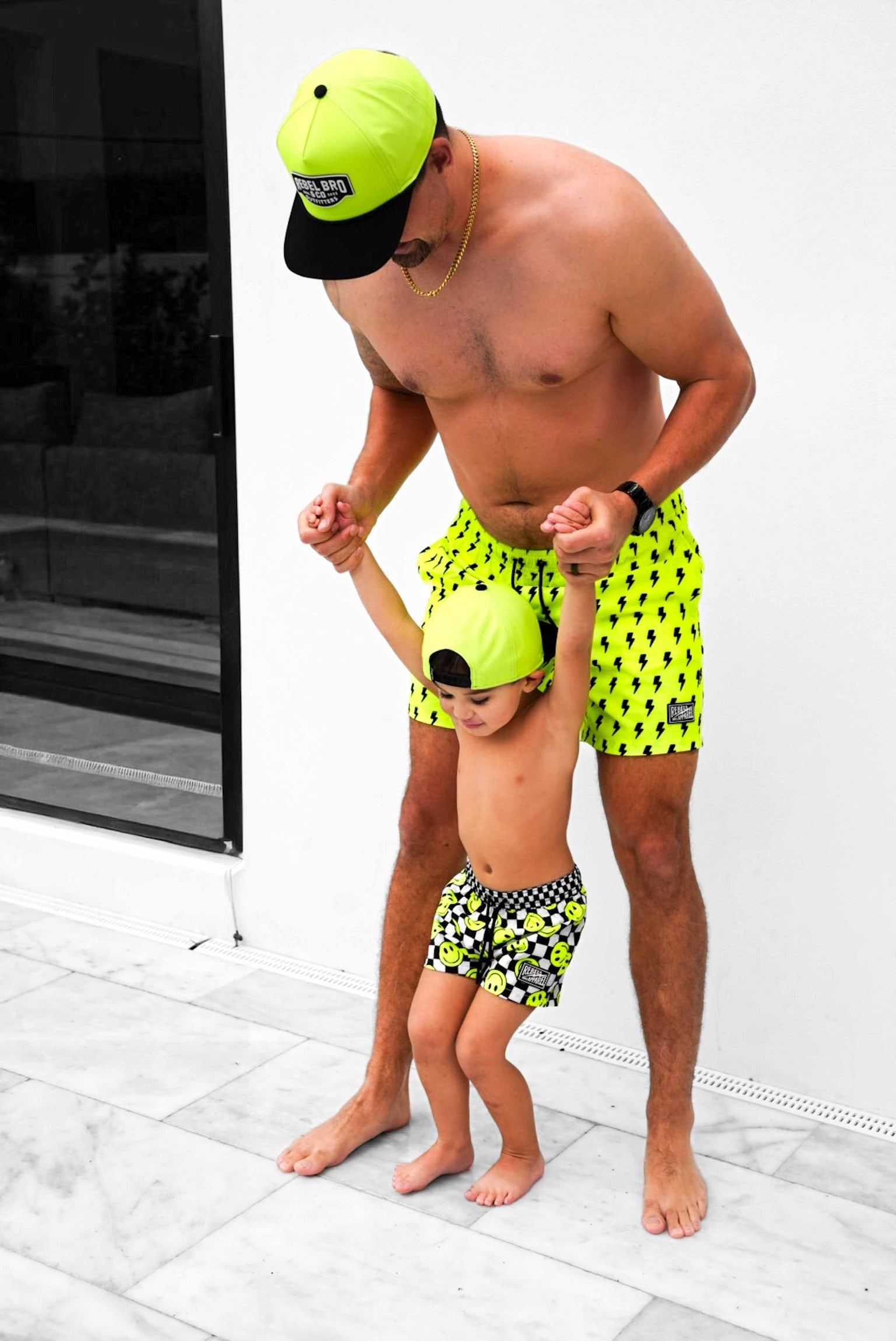Hybrid Swim Trunks in Neon Electric Lime Smileys - PREORDER