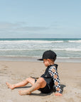 UPF 50 RASHGUARD ONESIE - HAPPY SURF